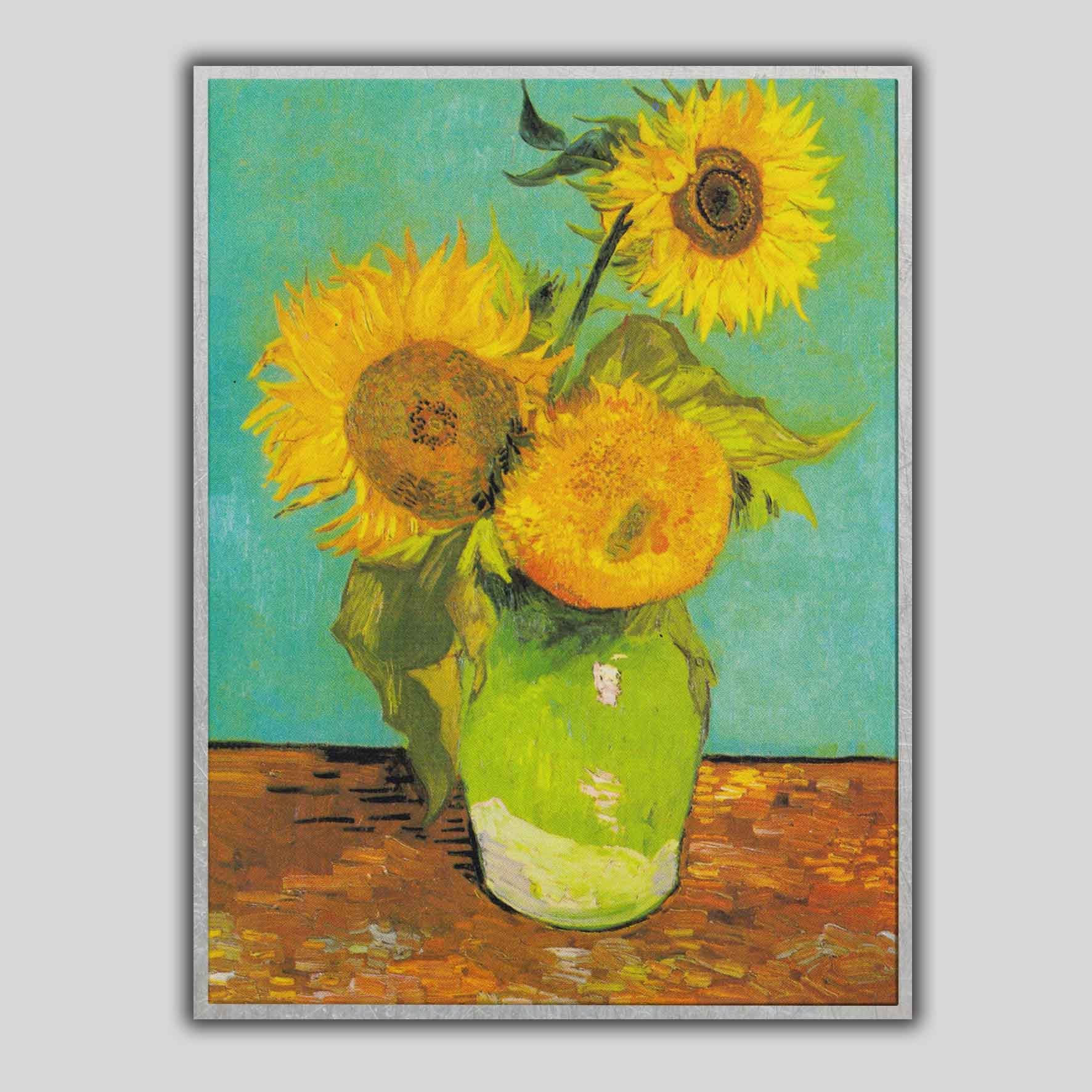 Vaso con tre girasoli